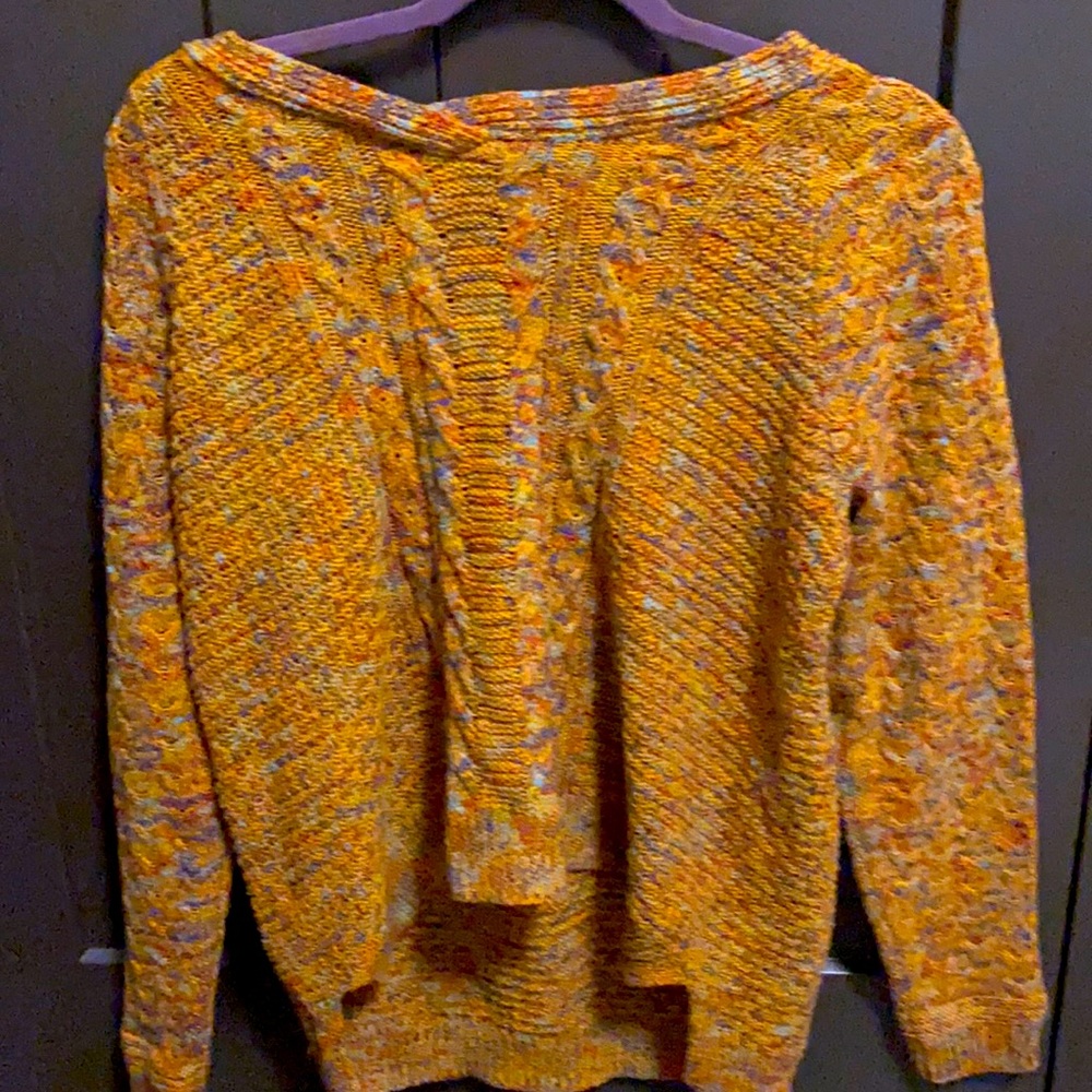 Mustard yellow sweater with color accents